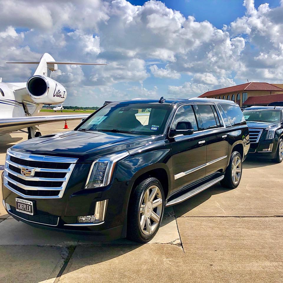 Black Cadillac Escalade ESV at private jet terminal