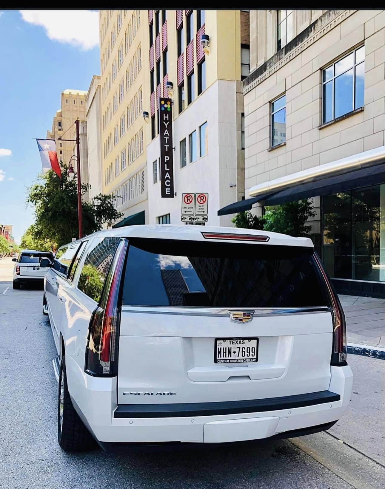 White Cadillac Escalade Stretch Limousine in downtown Houston